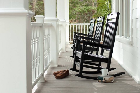 trex-transcend-porch-gravel-path-railings-classic-white-colornial-spindles-outdoor-furniture-black-rockers